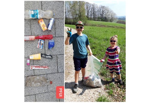 Kinder mit Müllsack und gesammeltem Müll