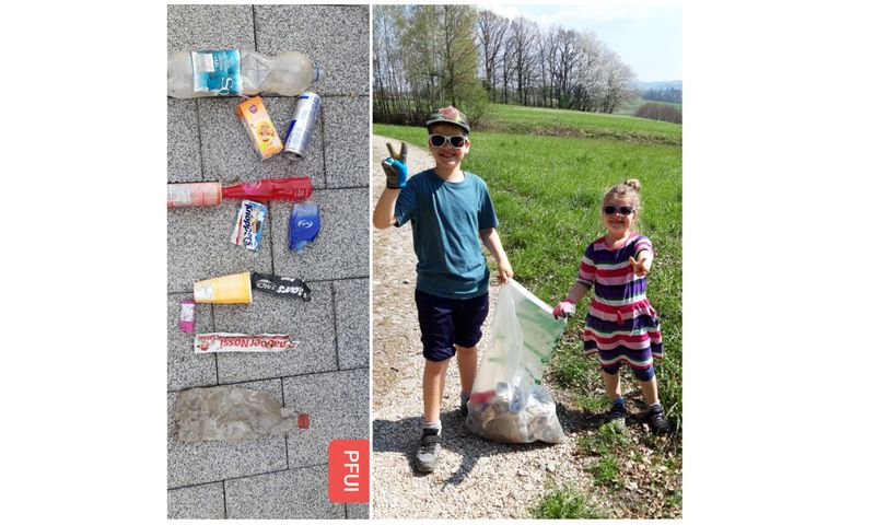 Kinder mit Müllsack und gesammeltem Müll